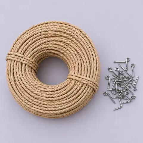Flat lay of a large coil of light tan laced Danish cord and a small pile of steel L-nails on pale lavender paper