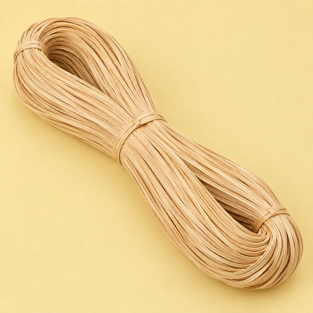 Large looped hank of glossy honey-blond strand chair cane tied in three places, on a butter yellow backdrop