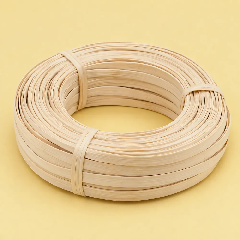 Coil of matte, pale cream flat reed strips about 1/2 in wide, tied, on a butter yellow backdrop