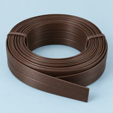 Tied coil of wide dark brown flat PE wicker strip with a faint wood grain texture on dusty blue paper