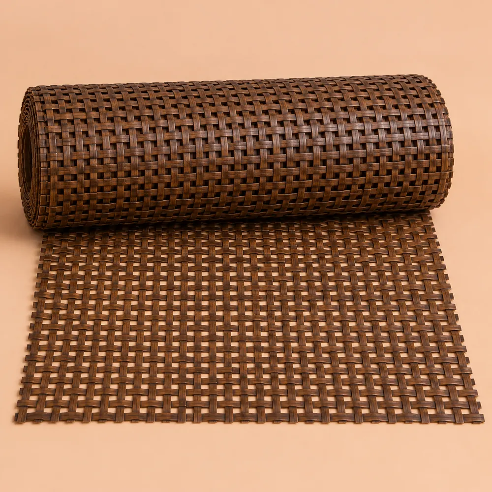 Roll of walnut-stained square weave cane webbing partly unrolled on a warm peach paper backdrop