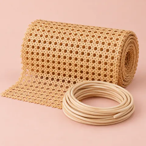 Roll of open weave cane webbing with a coil of reed spline resting in front of it